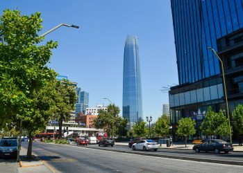 a very tall building towering over a city